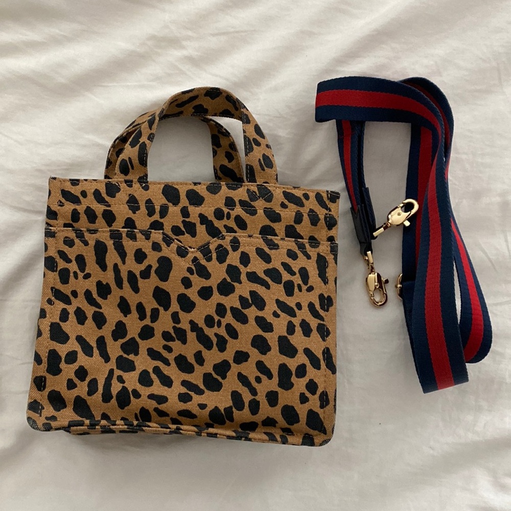 Stella and Dot cheetah print handbag with detachable striped crossbody strap